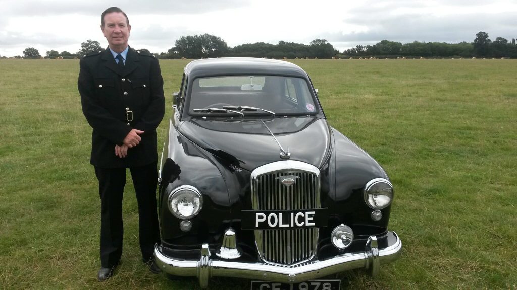 Ian in historical police uniform on a production